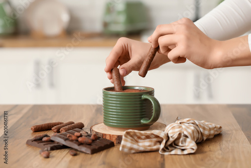 Female hands with chocolate...