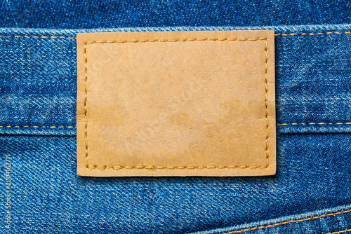 Photography Denim fabric and leather patch showing blank surface ready for branding or label
