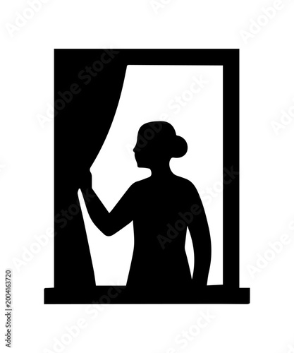 Silhouette of a woman peeking through a window curtain, looking outside
