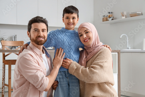 Happy Muslim family hugging...