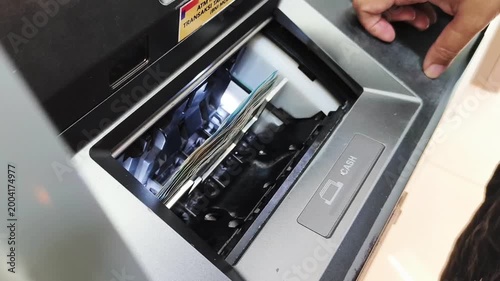 Close-up transaction process of withdrawing money from an ATM machine