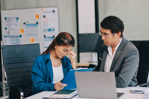 Quadro su tela Millennial Asian stressed depressed worried thoughtful professional male busines