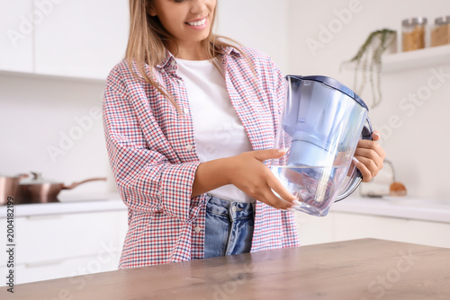 Young woman with water filt...