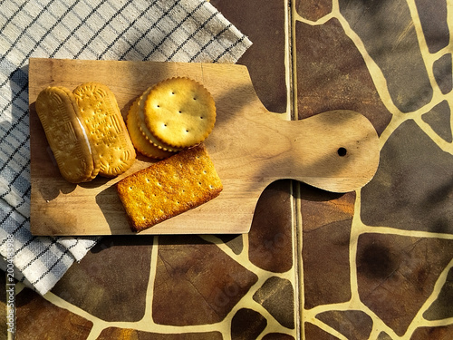 Bild auf Leinwand Delicious assortment of assorted biscuits and cookies on a wooden board, perfect