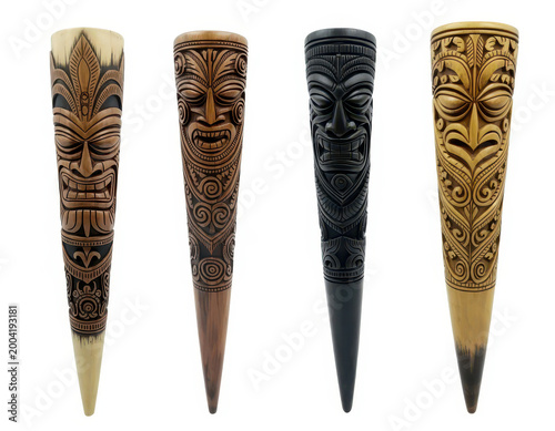 Four decorative wooden tiki masks with intricate carvings isolated on a plain white background