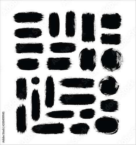 Collection of rough black brush strokes and paint smears on white background