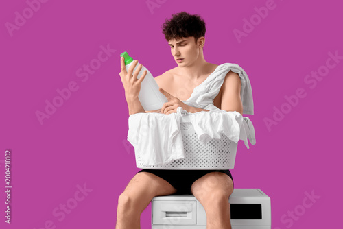 Young man in underpants wit...