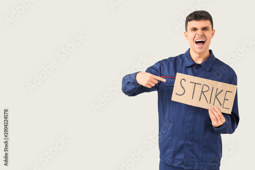 Protesting mechanic pointin...