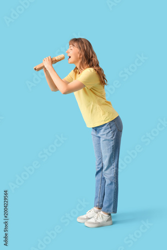 Young woman eating doner ke...