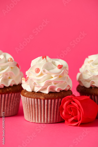 Tasty cupcake with rose flo...