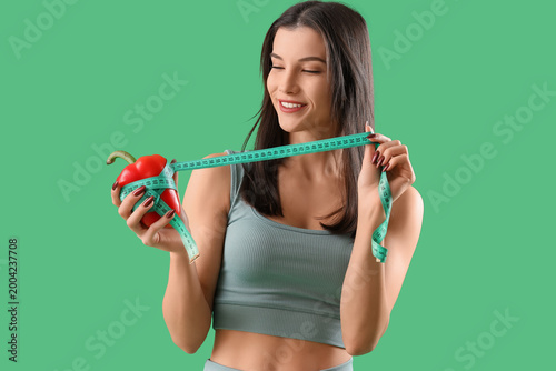 Sporty young woman with bel...