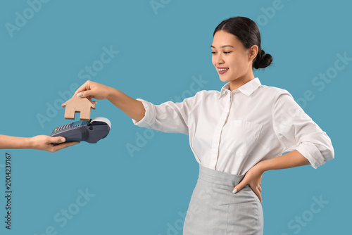 Asian real estate agent wit...