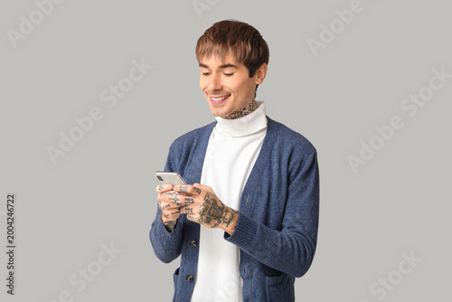 Happy handsome young tattoo...