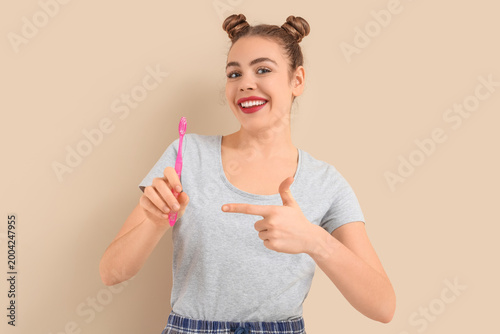 Beautiful young woman point...