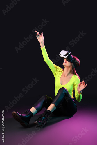 Young woman using VR glasse...
