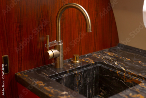 Photos warm lighting and compact layout enable quick freshening Lavatory sink cabin sea