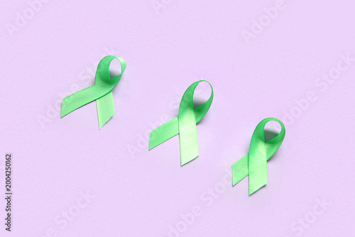 Green awareness ribbons on ...