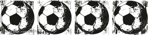 Four grunge soccer balls with worn texture on white background