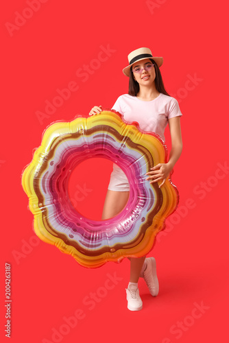 Young woman with inflatable...