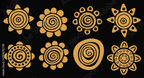 Quadro su tela Collection of Golden Tribal Sun Symbols with Swirls and Dots.