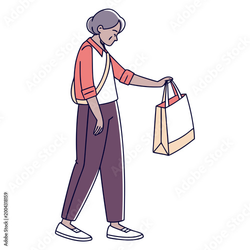 A woman holding a shopping bag in her hand while walking