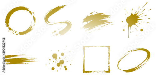 set of golden paint brush strokes splashes circles and abstract textured shapes isolated on white background for creative design elements vector