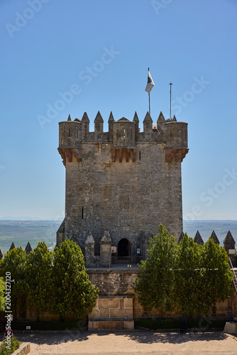 Almodóvar del río castle tower with flag flying