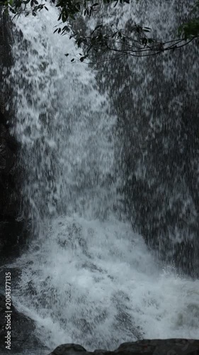 Close up of flowing waterfall stream, clear fresh natural water and peaceful wild nature landscape
