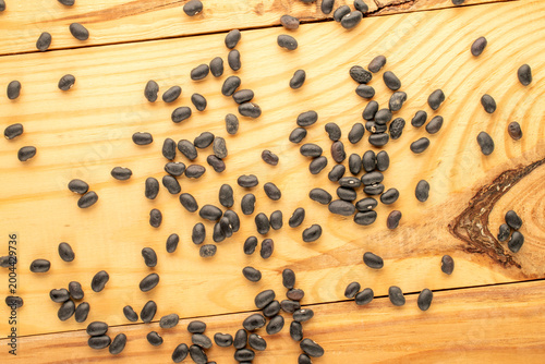 Dried beans, on a wooden table. Top view.