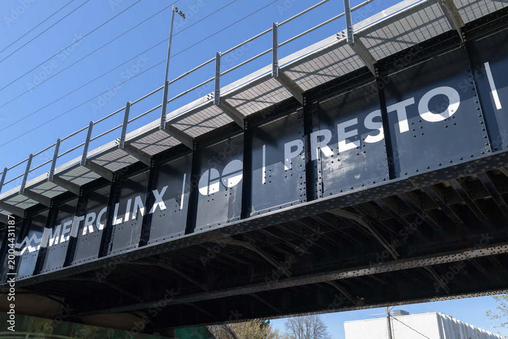 Fototapeta premium Go Transit (Metrolinx) steel overpass on Rogers Rd, Toronto