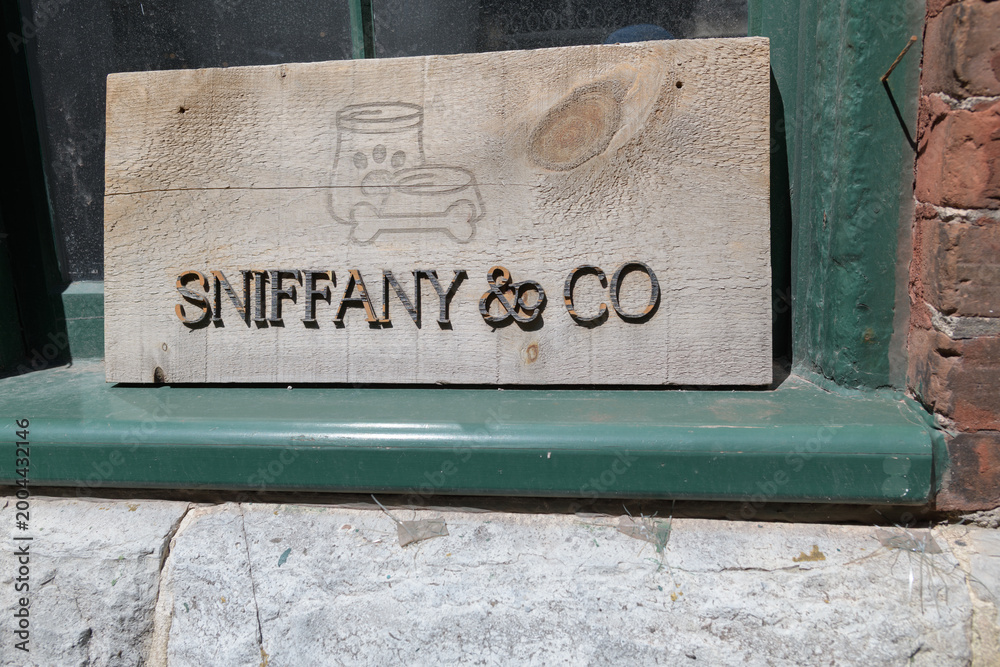 Fototapeta premium old sign at Sniffany & Co Pet Boutique & Spa, a pet store, located at 10 Case Goods Lane, Distillery District, Toronto