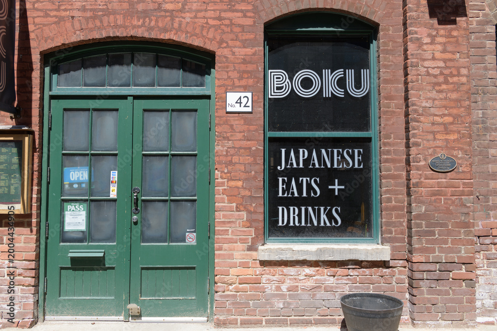 Fototapeta premium exterior of Boku, Japanese Eats + Drinks at 42 Gristmill Lane located within a historic Distillery District building, Toronto