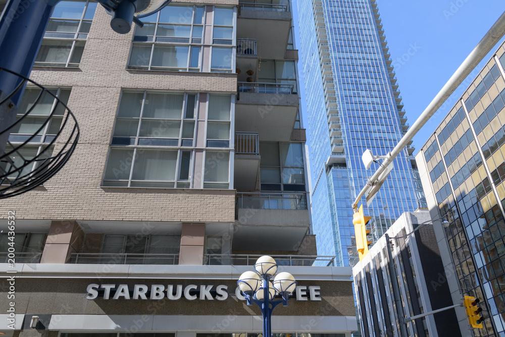 Naklejka premium sign on the exterior of Starbucks Coffee Company located at 1250 Bay St, 80 Cumberland, The Maxus, Yorkville, Toronto