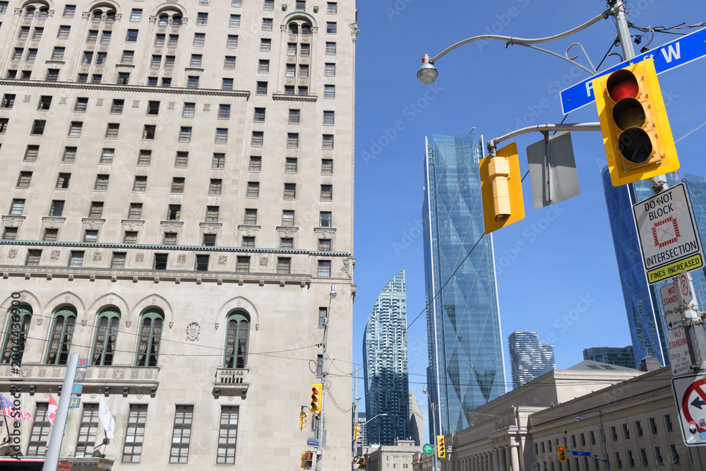 Naklejka premium looking east from intersection of University Av, York St, and Front St W to (left) Fairmont Royal York hotel and office buildings, Toronto
