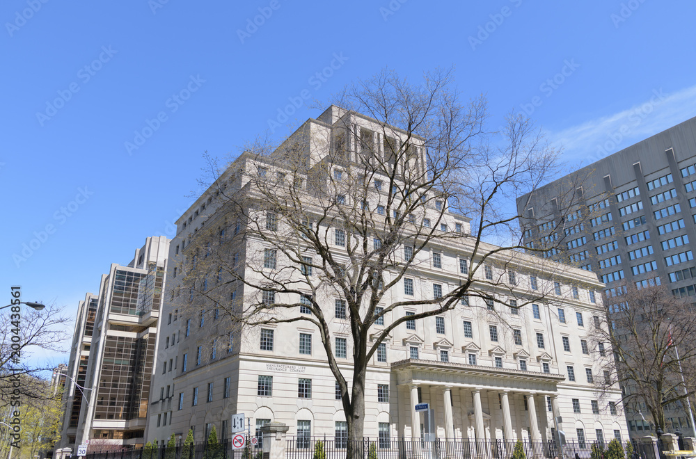 Fototapeta premium exterior building and sign of The Manufacturers Life Insurance Company (inside Manulife Financial Headquarter) located at 200 Bloor St E, Toronto