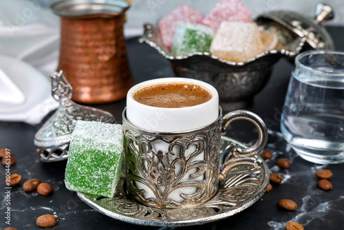 Türk kahvesi Turkish coffee in a cup served with Turkish delight	