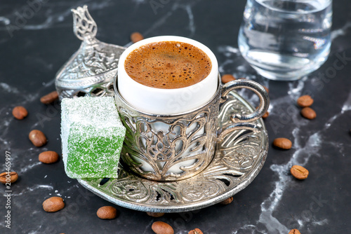 Türk kahvesi Turkish coffee in a cup served with Turkish delight	