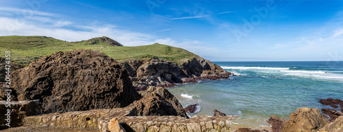 Canvastavla Hermitage santa justa embedded inside coastal rock formation along the cantabria