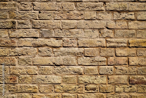 Aged textured stone wall masonry background