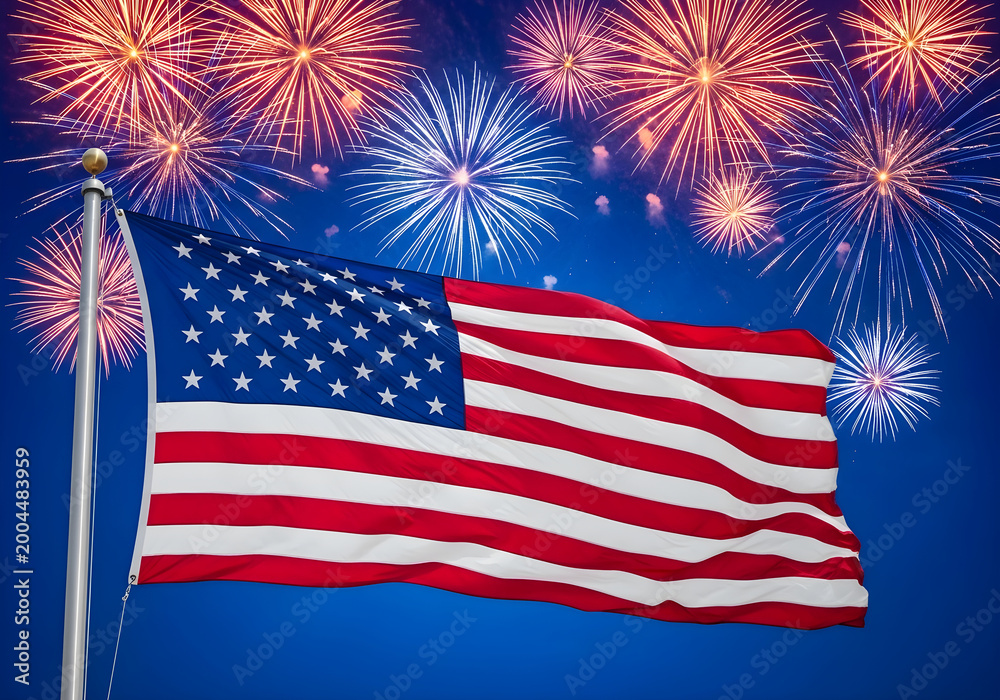 Obraz premium American flag on flagpole waving with fireworks background for 4th of July