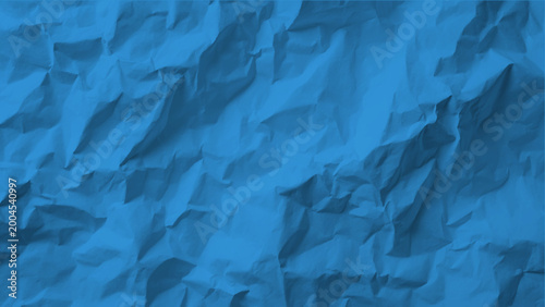 Blue crumpled paper texture background with folds and creases