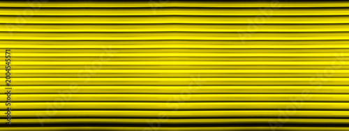 Schilderij op canvas a metallic texture with a vertical line pattern, which is commonly used as a bac