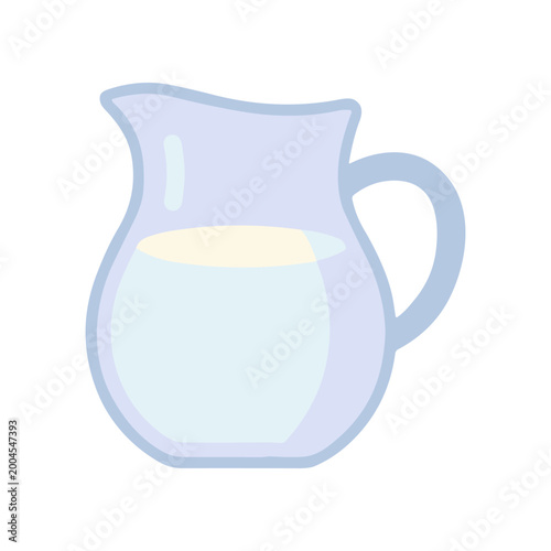 Glass pitcher with milk inside.