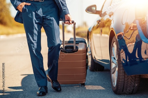 man with luggage at airport