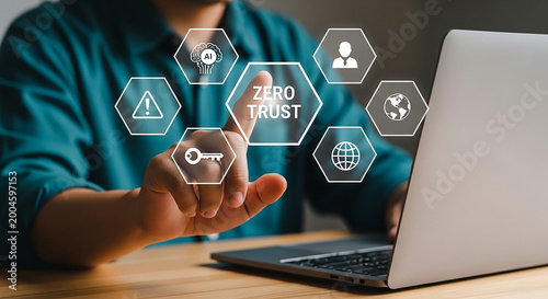 Securing Digital Frontiers: A professional uses laptop and touch the zero trust concept icons, representing the essence of data protection and cybersecurity measures.