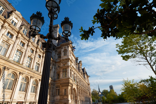 Paris city hall and trditional Parisian lamppost in the foreground Paris, France