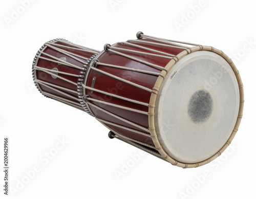Traditional wooden dholak drum with white skin head and tension ropes on a white background