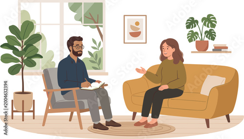 A man therapist with glasses and a beard listens to a woman client on a yellow sofa in a cozy counseling office with plants and a window.