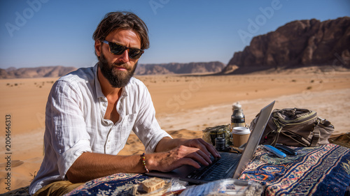 Digital nomad designer enjoys creative work amid stunning desert landscape
