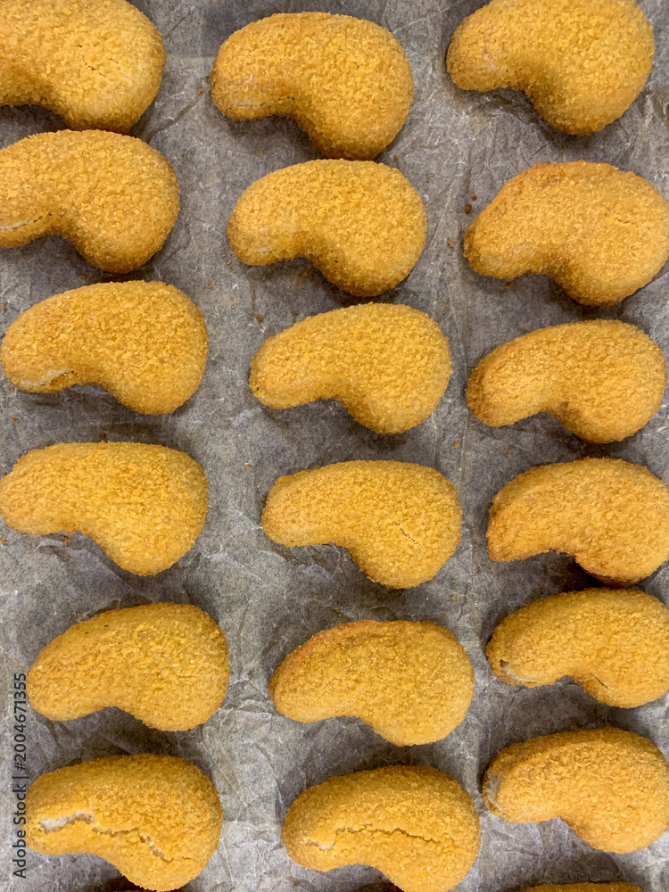 Fototapeta premium freshly baked nuggets on a baking sheet for the oven.